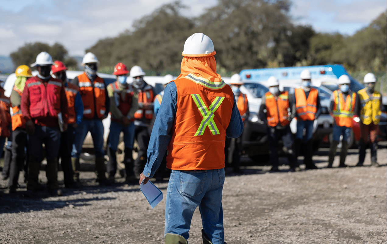 Team meeting at outdoor construction area